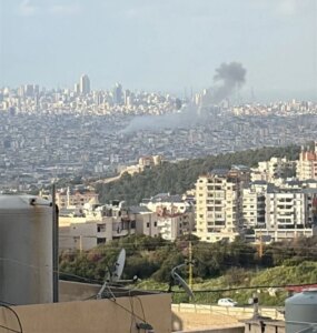 Israel threatens to escalate strikes, Hezbollah threatens to target infrastructure, and warns residents of the suburb